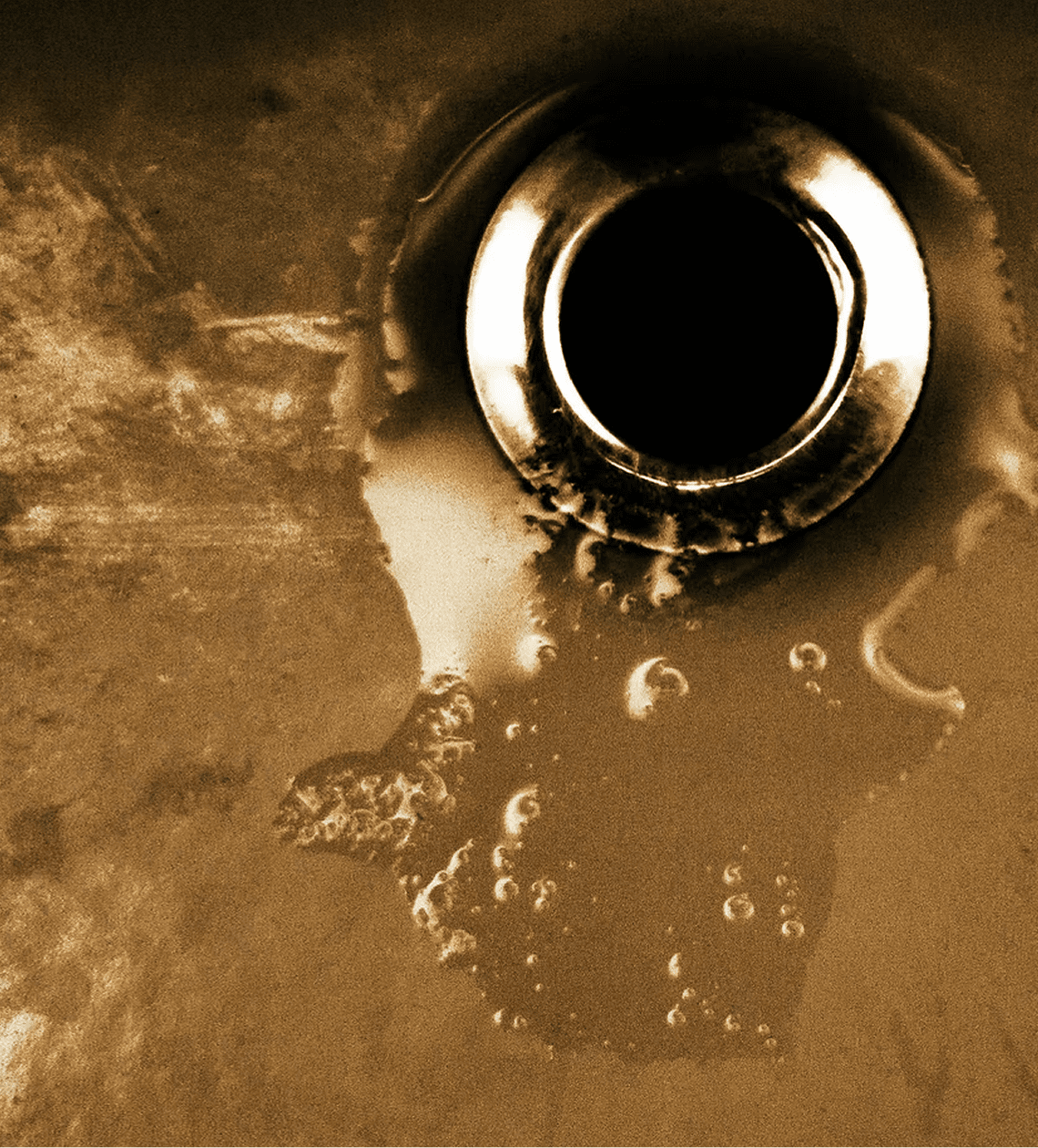 Close-up of corroded sink drain