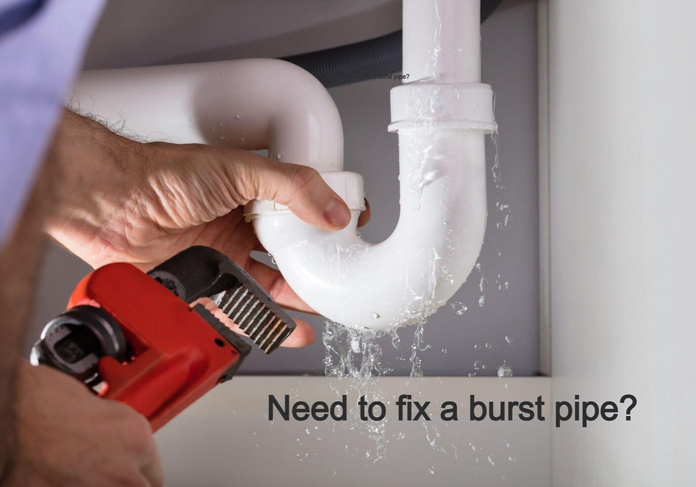 Plumber fixing leaking pipe under sink